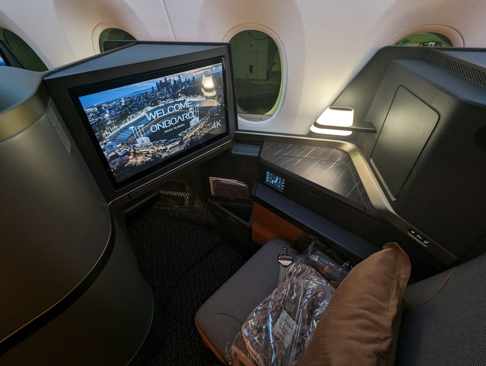 A view of the inside of an airplane with a television