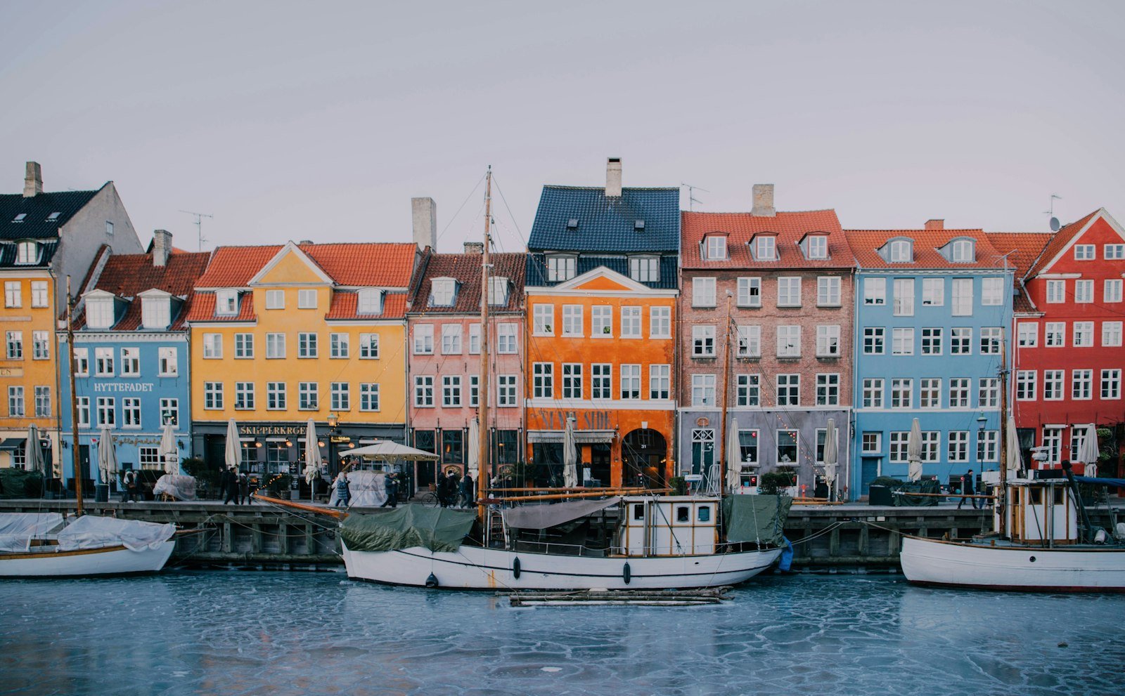 White and blue boat on water near concrete building during daytime, Nyhavn, København K, Denmark