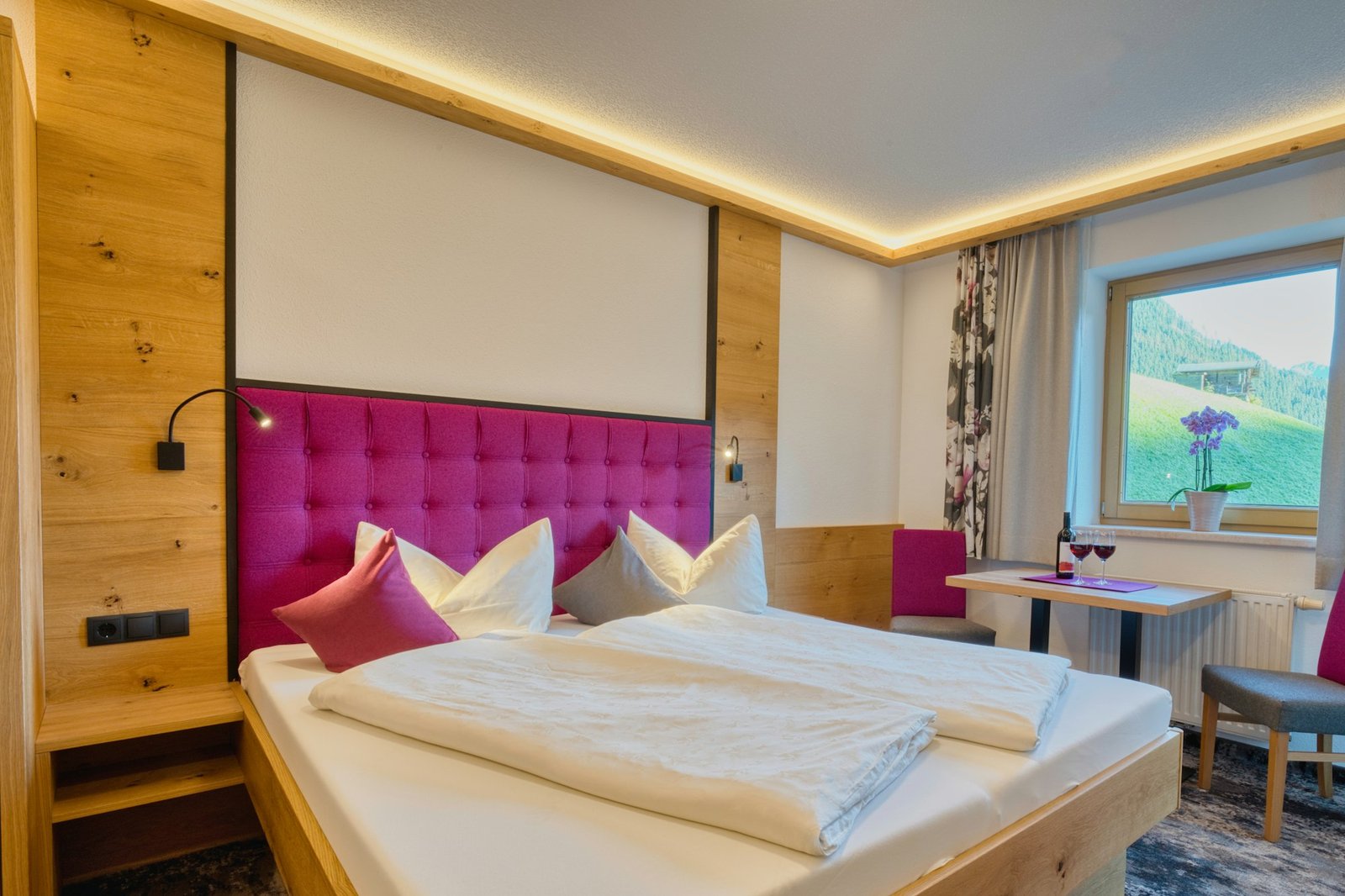 A cozy hotel room with a large bed and window