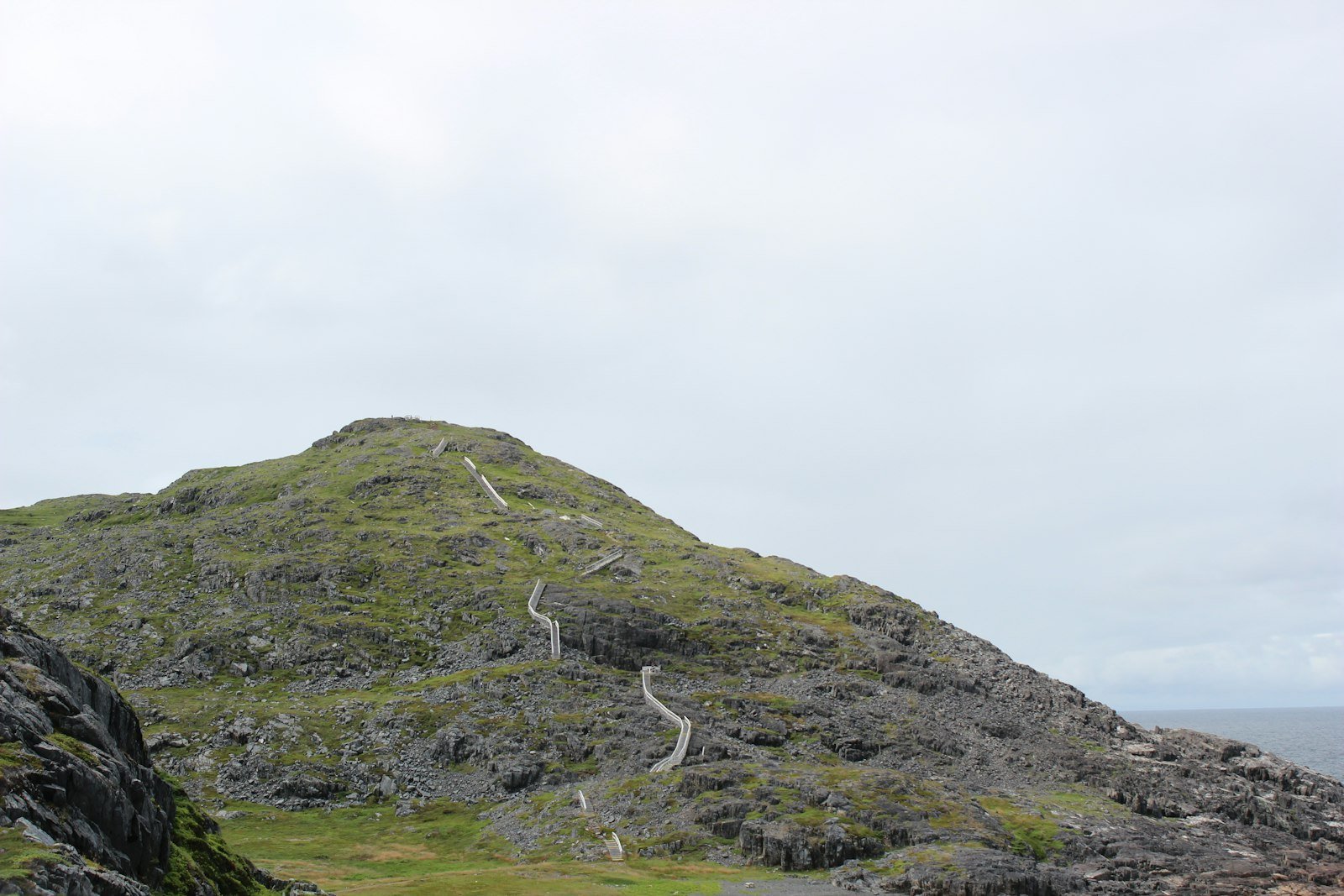 A grassy hill with a path going up it, Fogo Head Hiking Trail, Fogo, NL, Canada