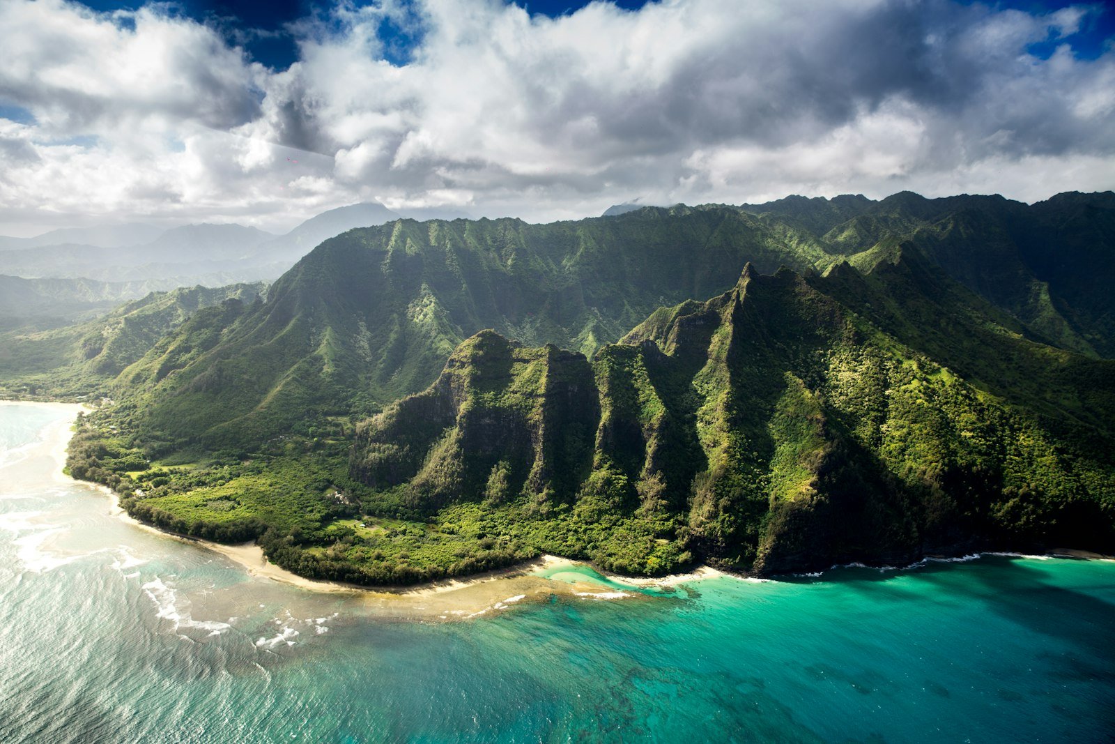 An aerial view of the lush green Na Pali Coast mountains in Kauai, Hawaii, Kauai County, United States
