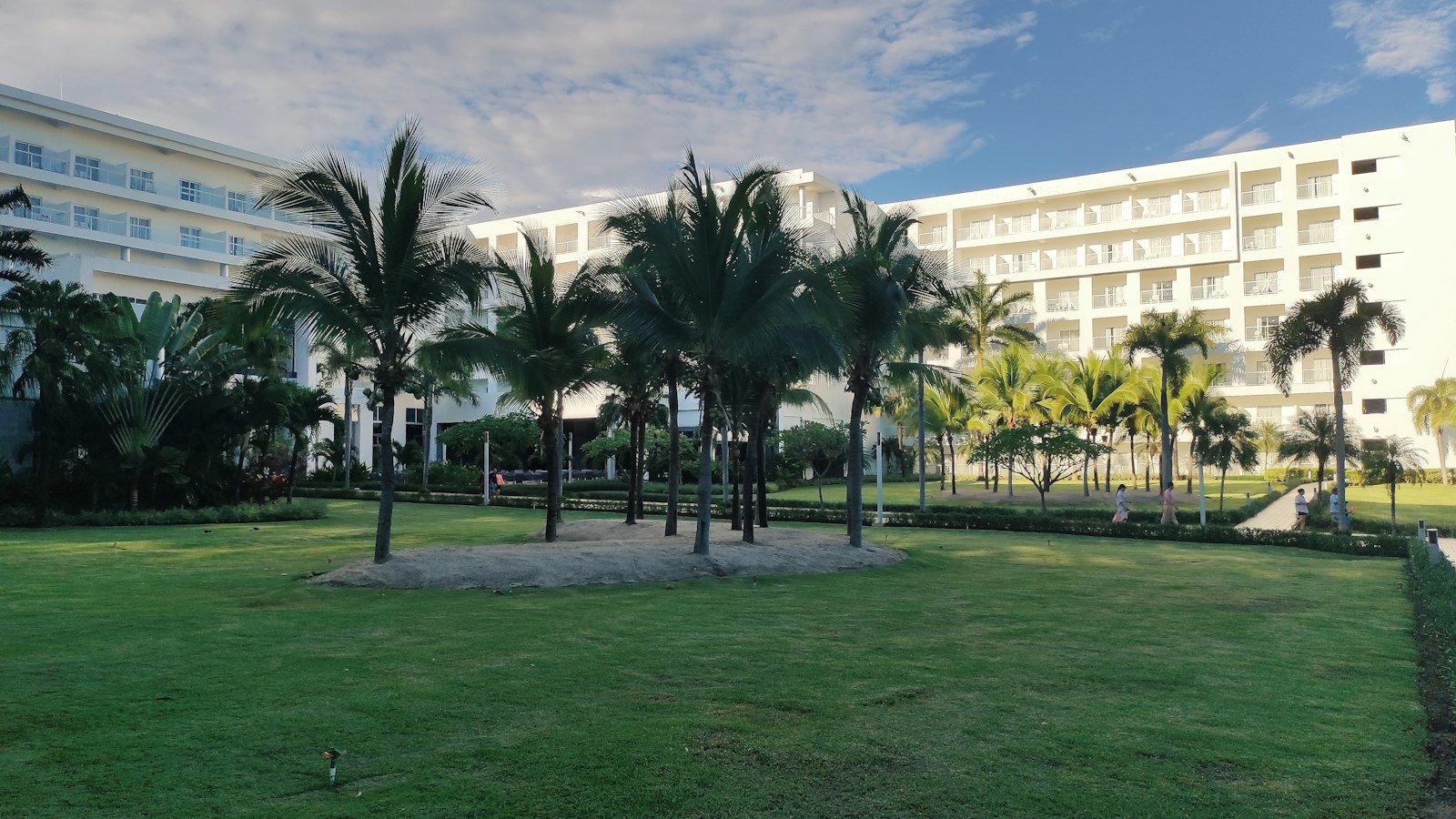 A building with palm trees and a lawn in front of it, Hotel Riu Playa Blanca, Rio Hato, Panama