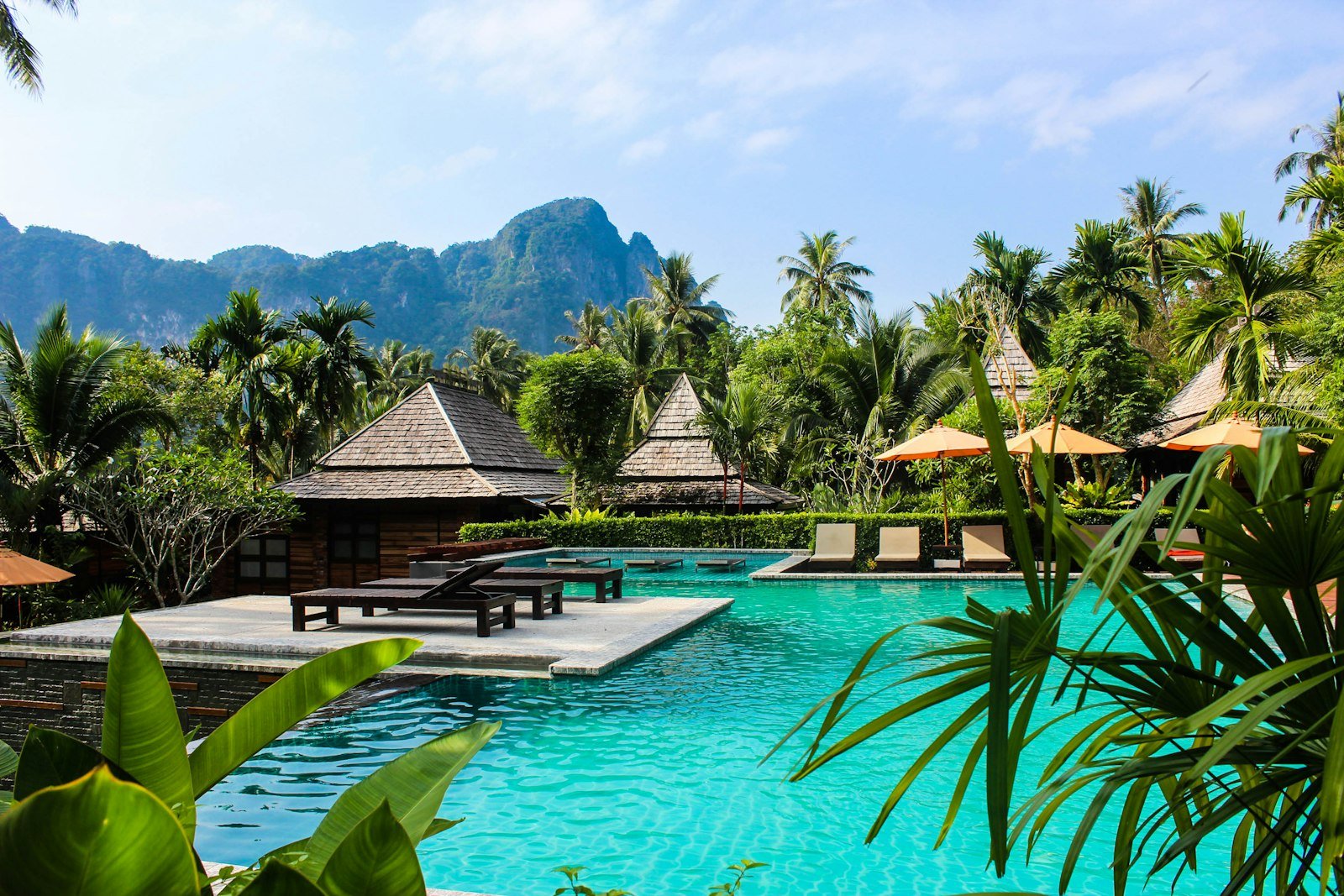 Photo of brown bench near swimming pool, Ao Nang, Thailand