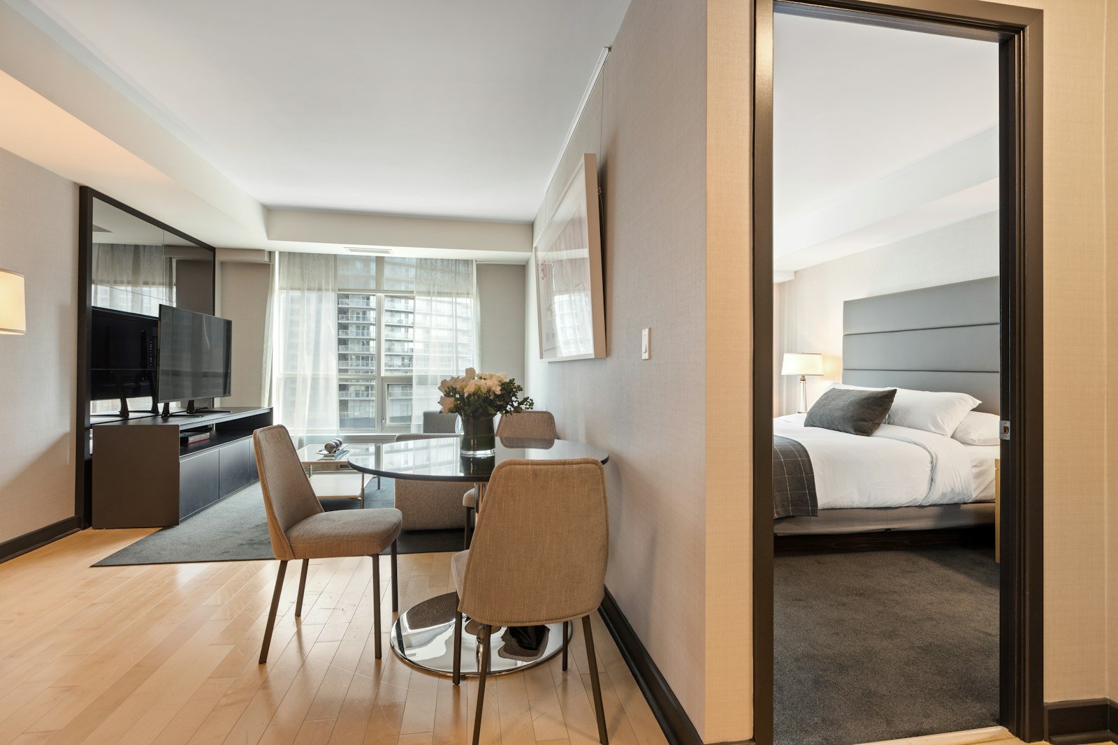 Brown wooden chair beside white bed