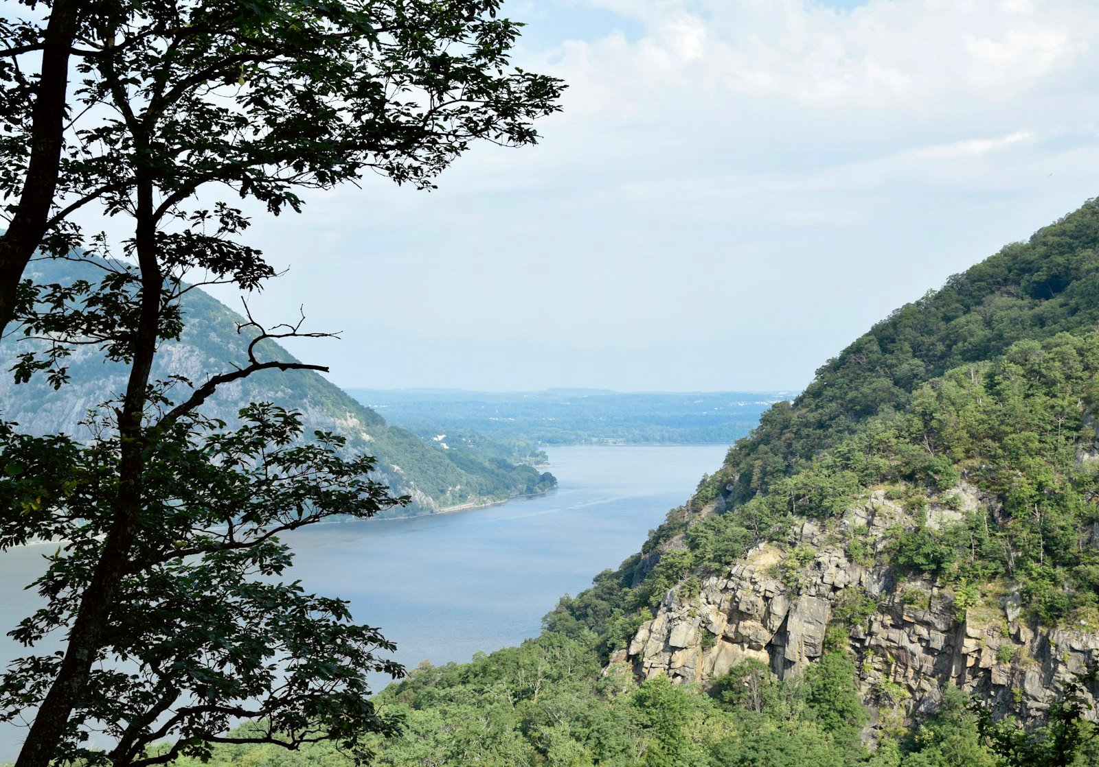 A scenic river flows between lush green mountains, Cold Spring, NY, USA