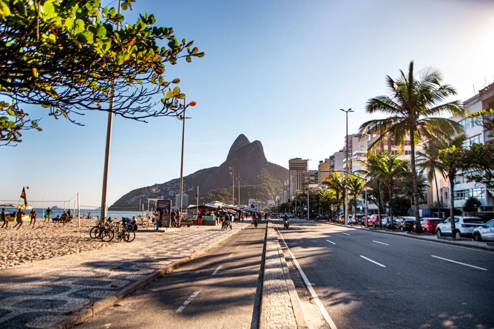 Ipanema Beach promenade with Two Brothers mountain in Rio de Janeiro