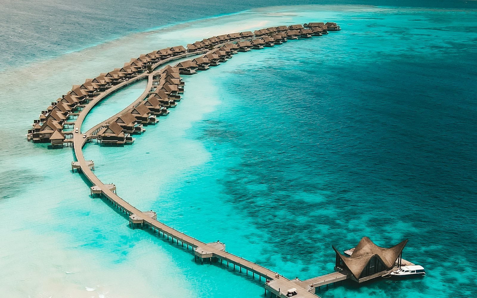 Aerial view of overwater villas at JOALI Maldives