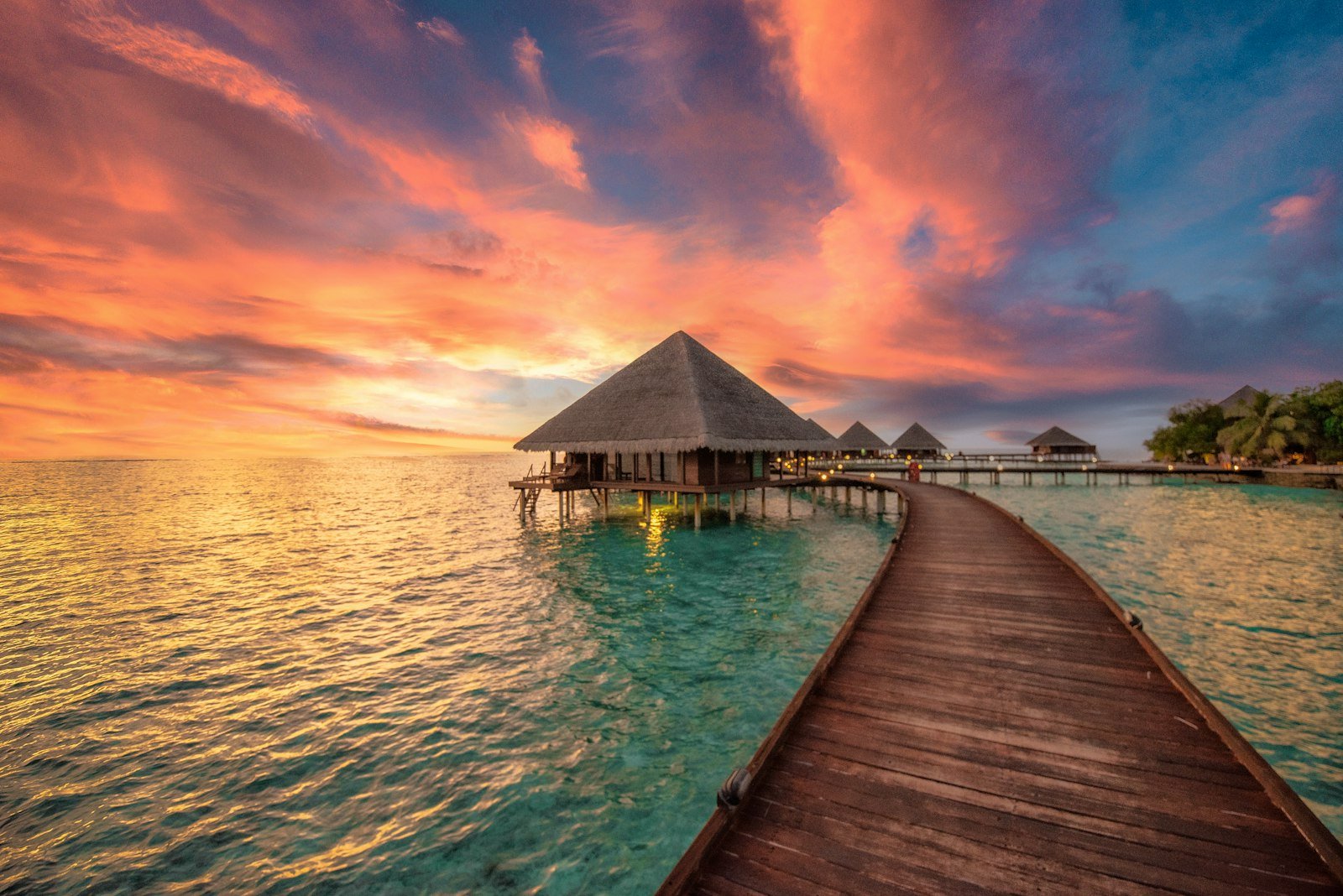 A dock leading to a hut in the ocean