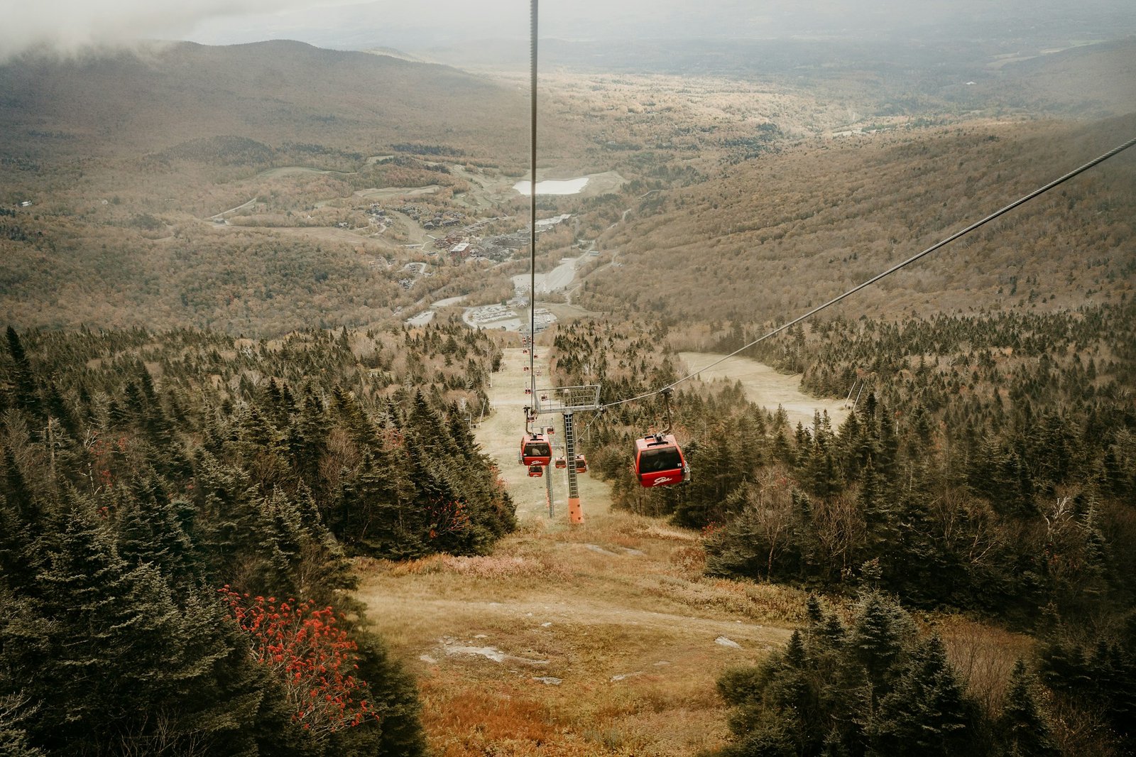 A gondola riding up a mountain above autumn trees, Gondola Skyride, Mountain Road, Stowe, VT, USA