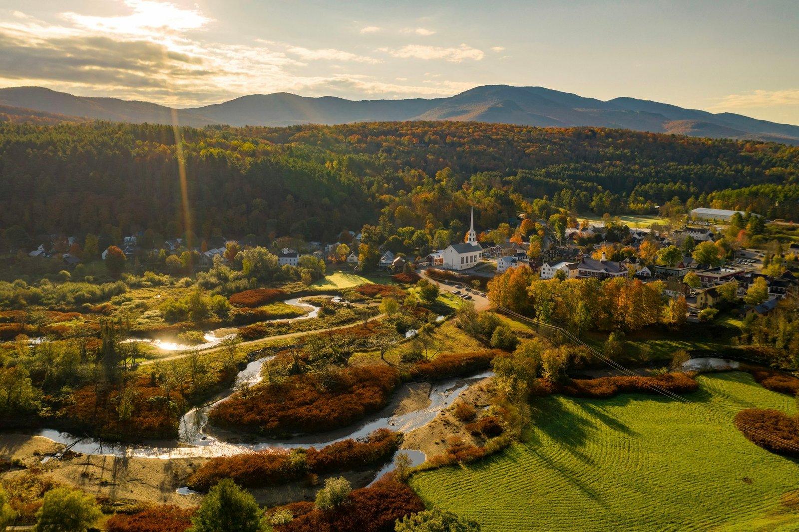 An aerial view of a small town surrounded by mountains, Stowe, Vermont, USA