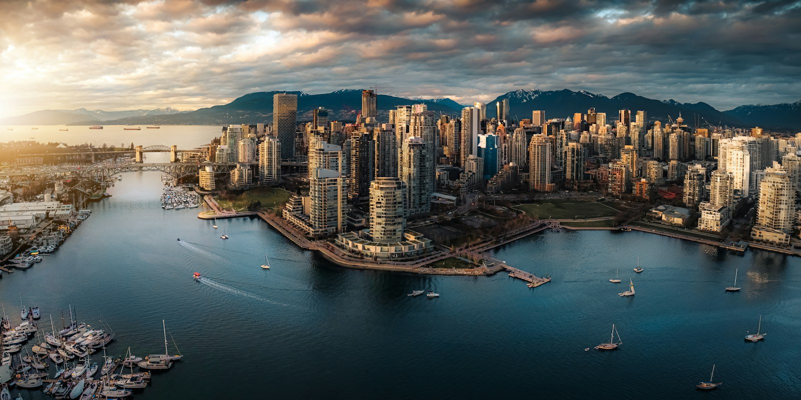 Aerial view of the False Creek waterfront and Vancouver skyline at golden hour, Vancouver, BC, Canada