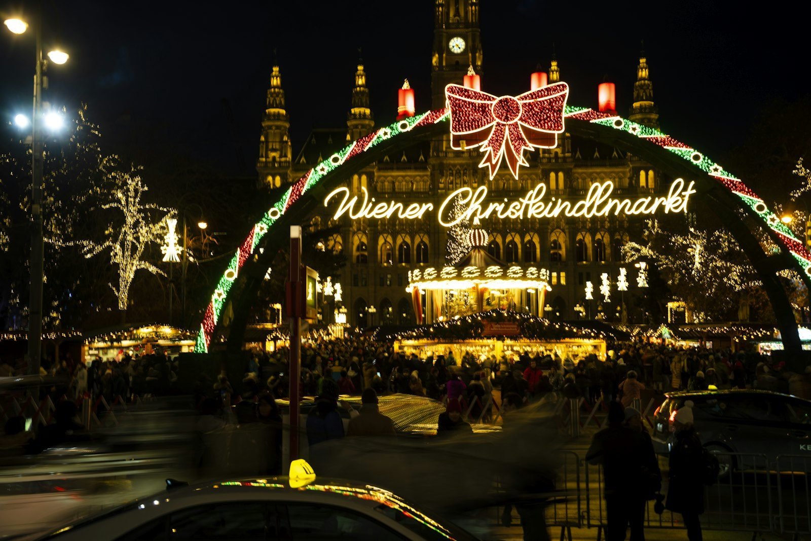 A Vienna Christmas market glowing with lights at night